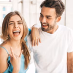 couple-with-sunglasses-posing-street_158538-16662