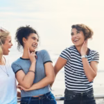 laugh-girl-friends-by-beach-travel-adventure-vacation-joy-happiness-with-freedom-youth-female-students-outdoor-together-summer-break-holiday-carefree-with-diversity_590464-452975